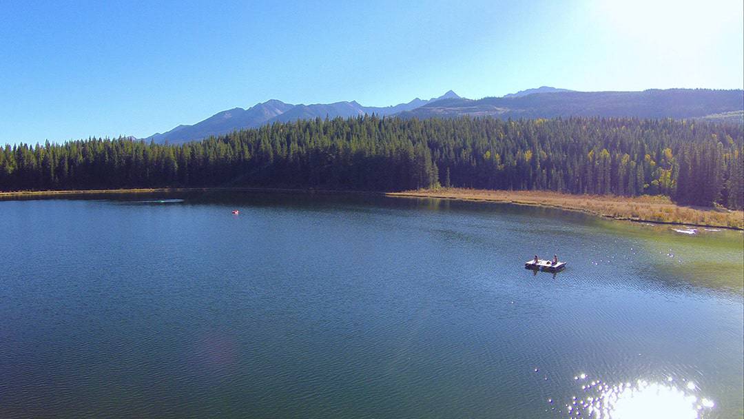 People floating and relaxing at Cedar Lake in Golden BC